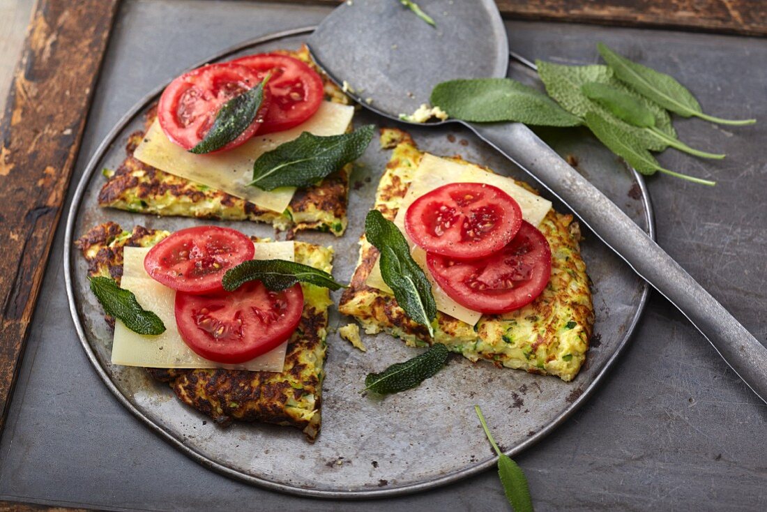 Vegetarian parsnip cakes with cheese, tomatoes and sage