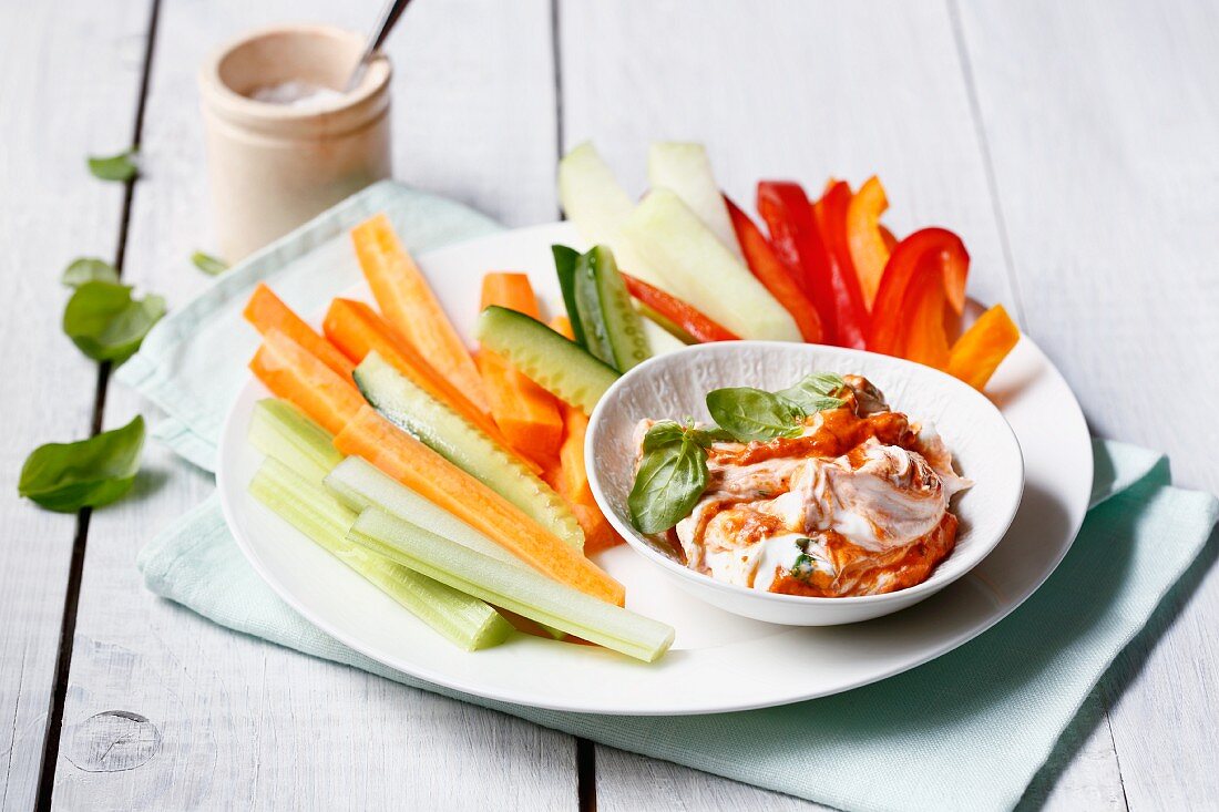 Vegetable sticks with a red pesto dip