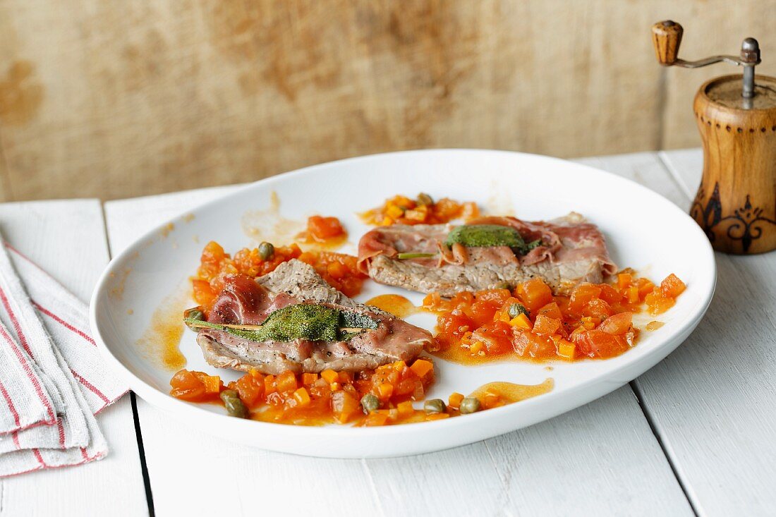 Saltimbocca with a tomato and caper sugo