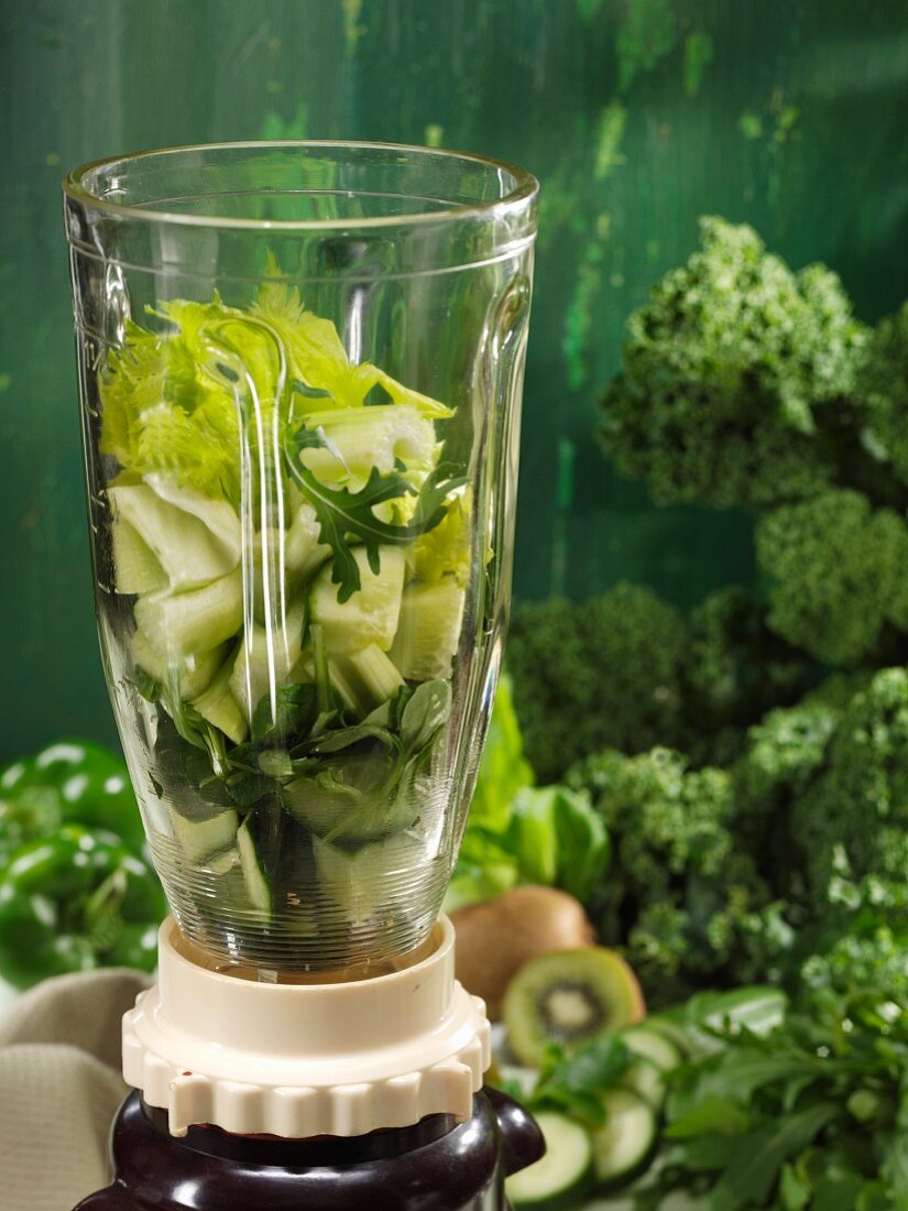 Ingredients for green smoothies in a mixer