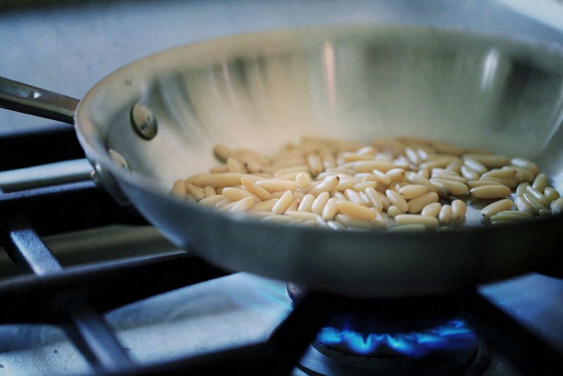 Toasting pine nuts