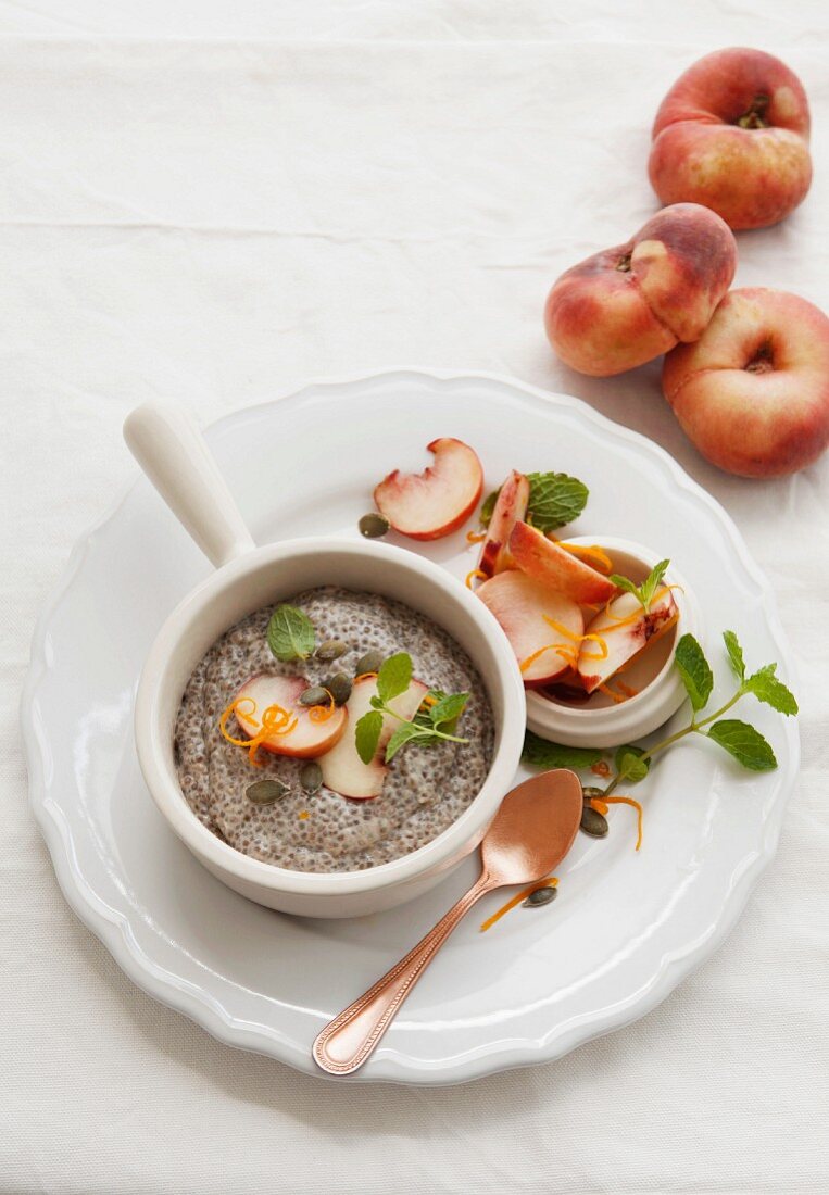 Almond, coconut and chia seed pudding with peach and mint salsa