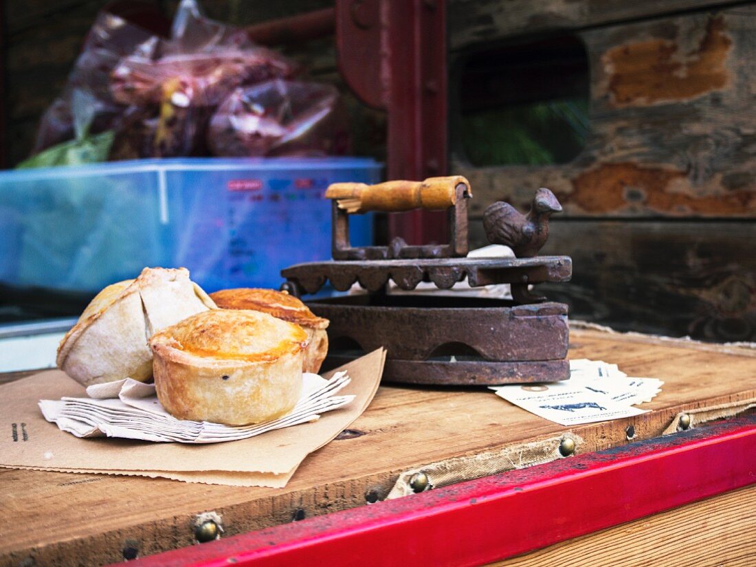 Mini pies for sale on a market stand
