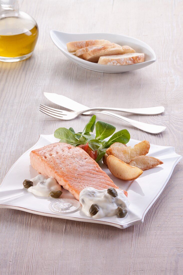 Baked salmon fillet with a caper sauce