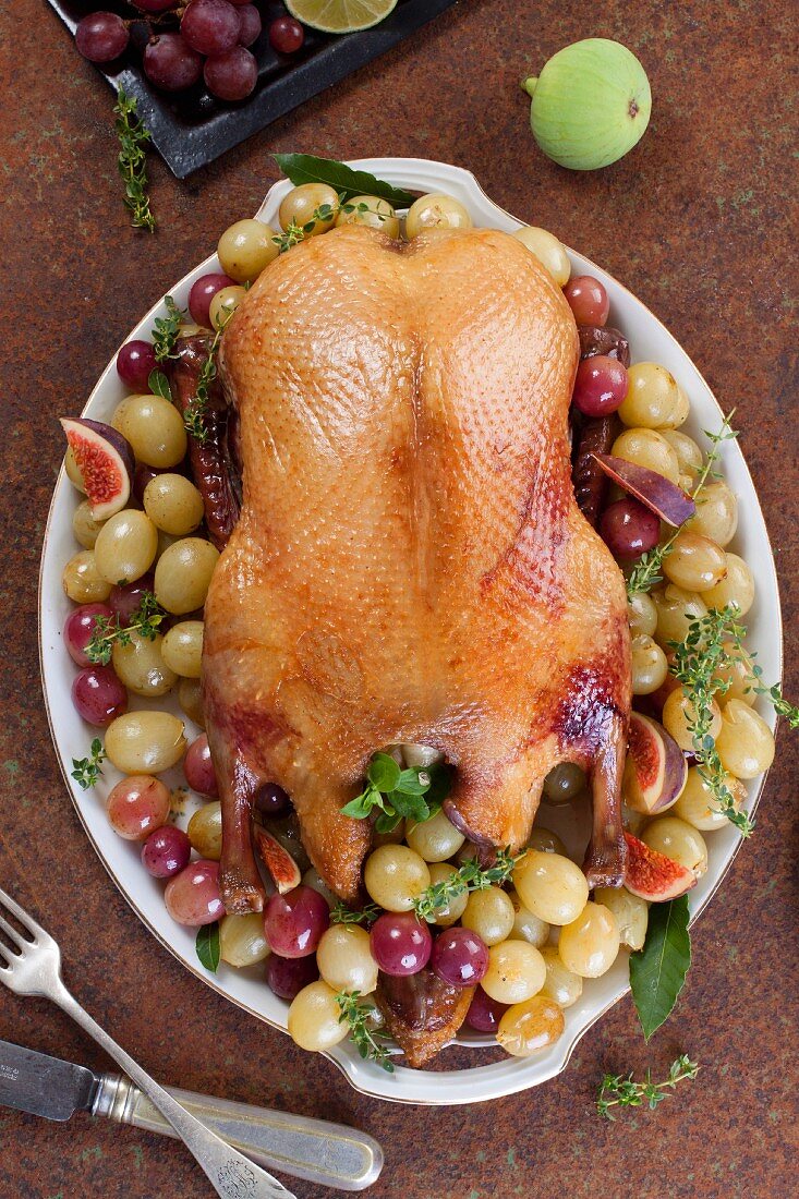 Roast duck with grapes and figs