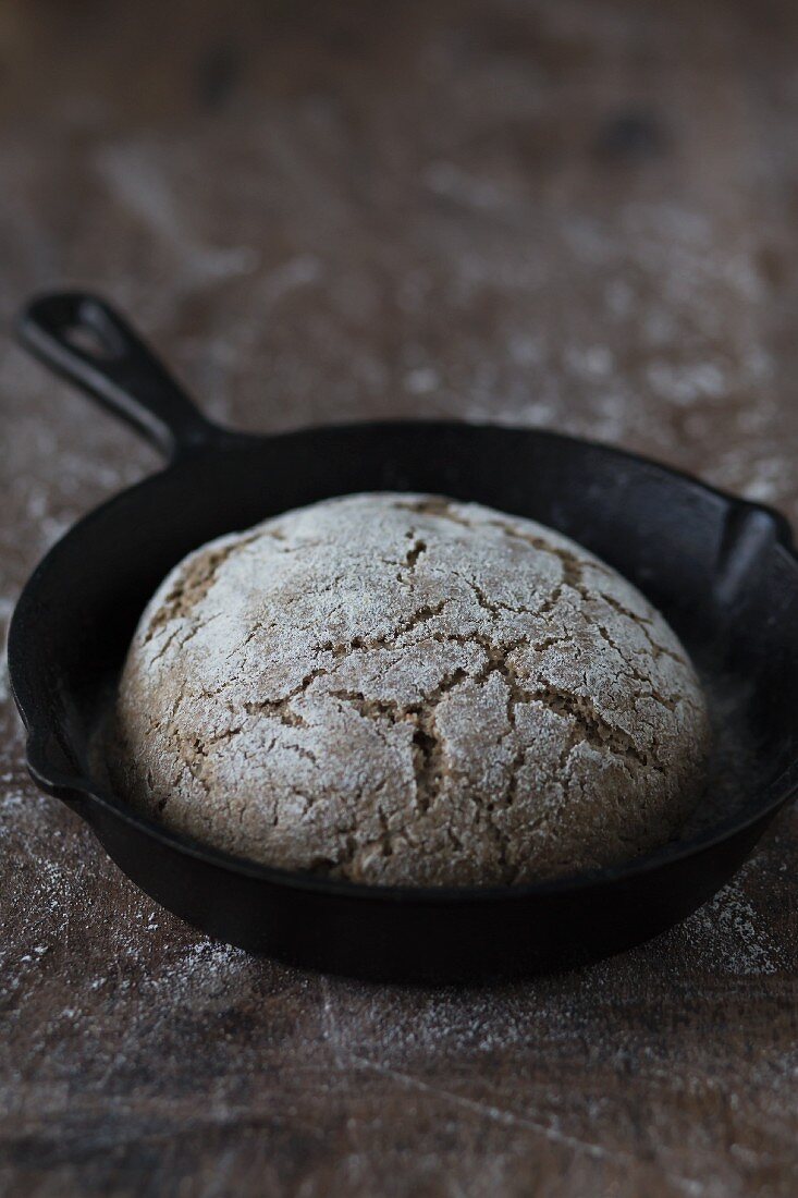 Rustic sourdough bread in a pan