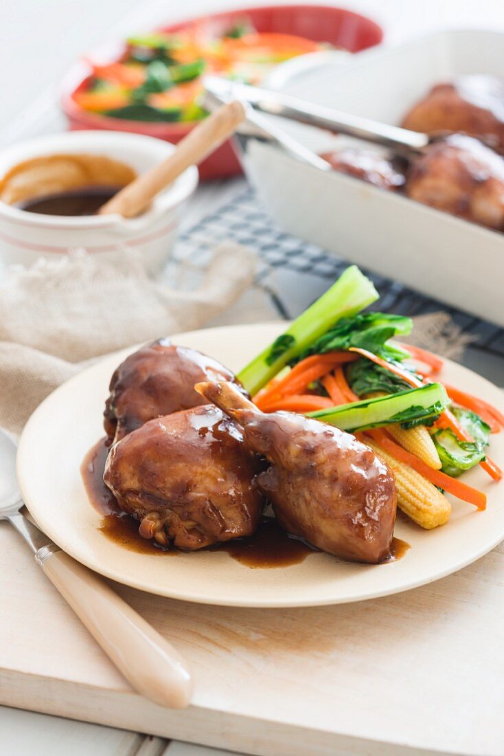 Chicken with a honey and soy glaze serve with oriental vegetables