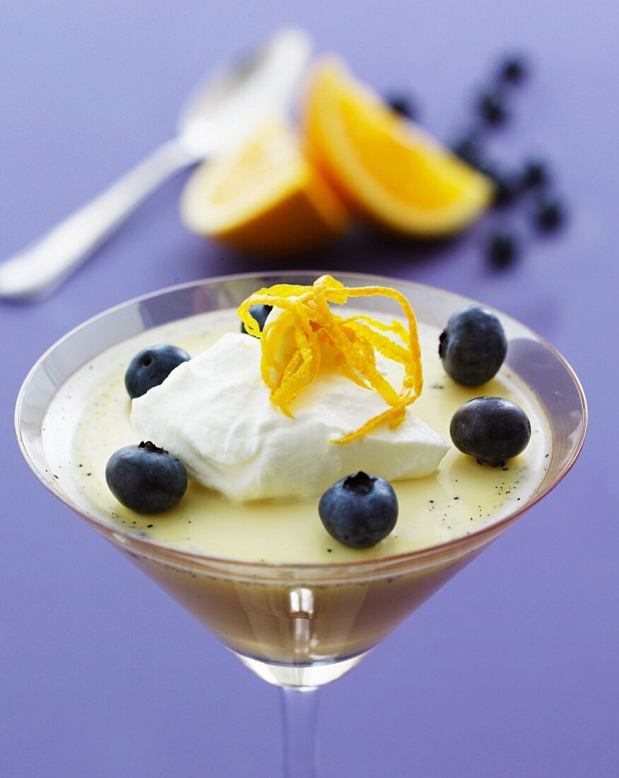 Orange cream with blueberries and whipped cream