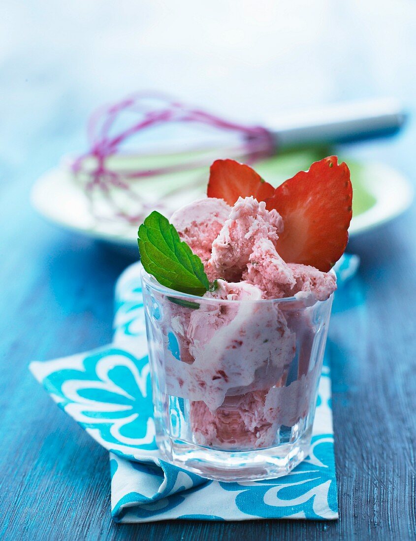 Strawberry ice cream with fresh strawberries in a glass