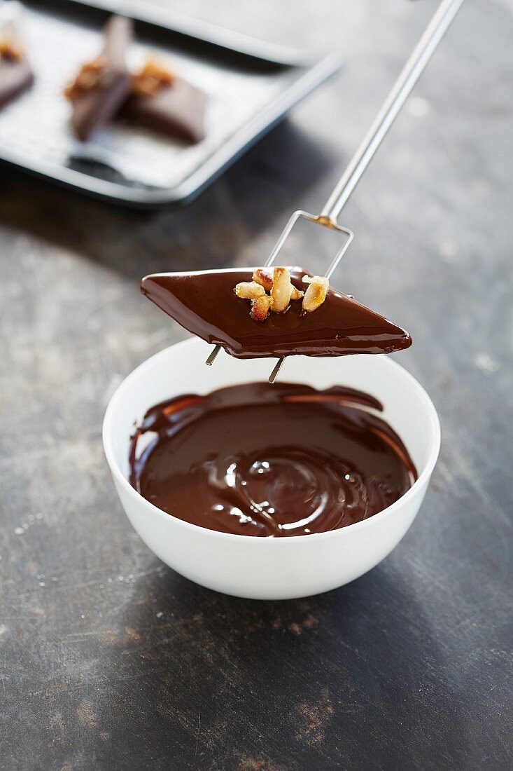 Chocolate caramel diamonds with pine nuts