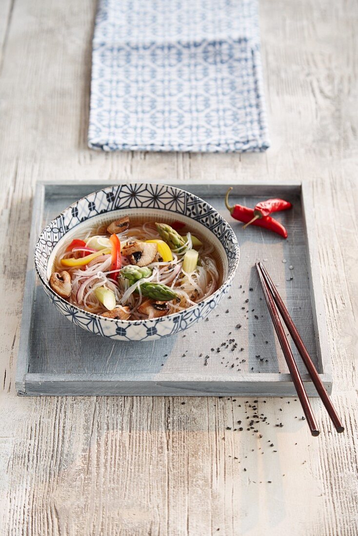 Noodle soup with asparagus and chilli peppers (Asia)