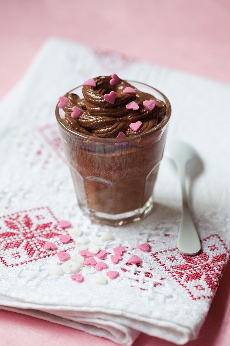 Chocolate mousse decorated with pink sugar hearts
