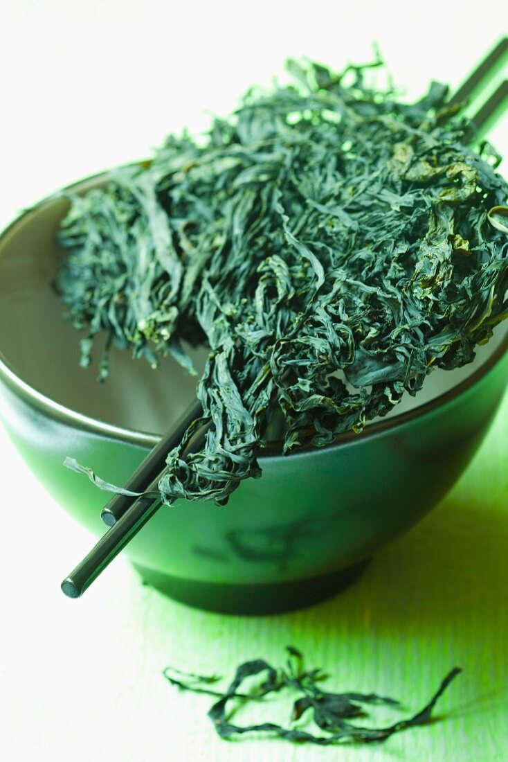Wakame in a ceramic bowl with chopsticks