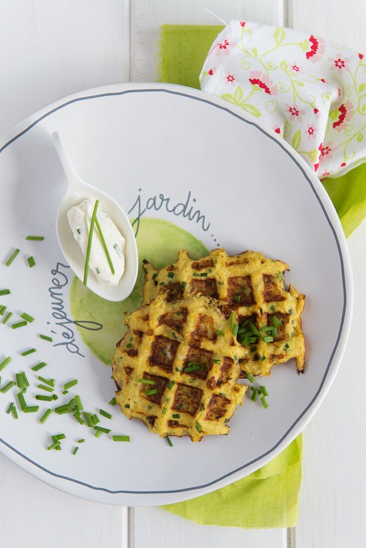 Spicy potato waffles with crème fraîche and chives