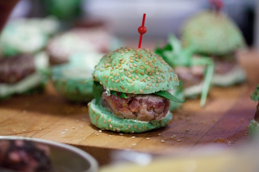 A mini green party burger with steak tartar