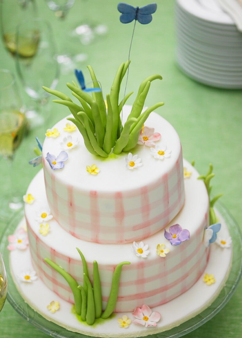 Two-tiered celebration cake decorated with flowers