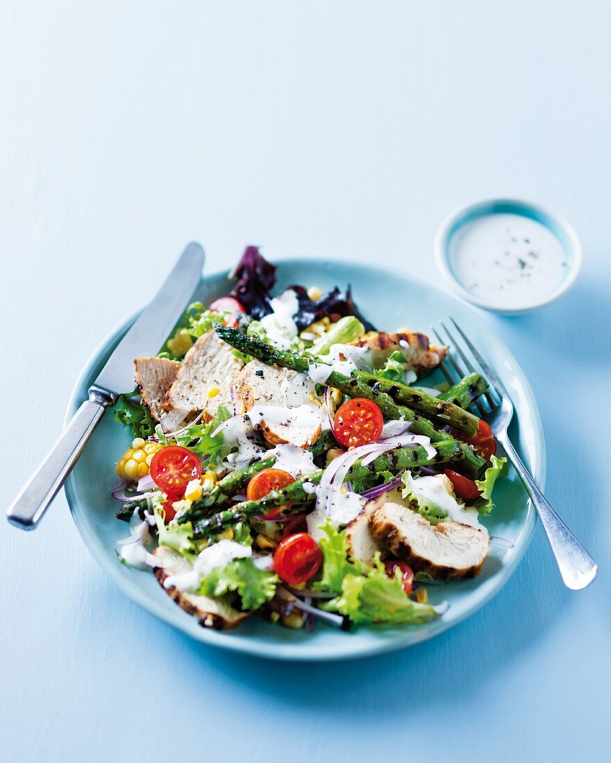 Grilled chicken breast salad with green asparagus