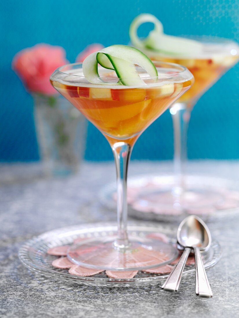 Jelly with Pimms and fruit in champagne glasses