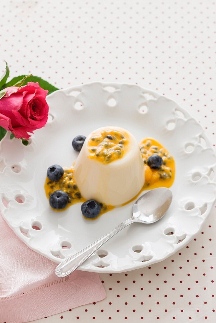 Panna cotta with passion fruit sauce and blueberries