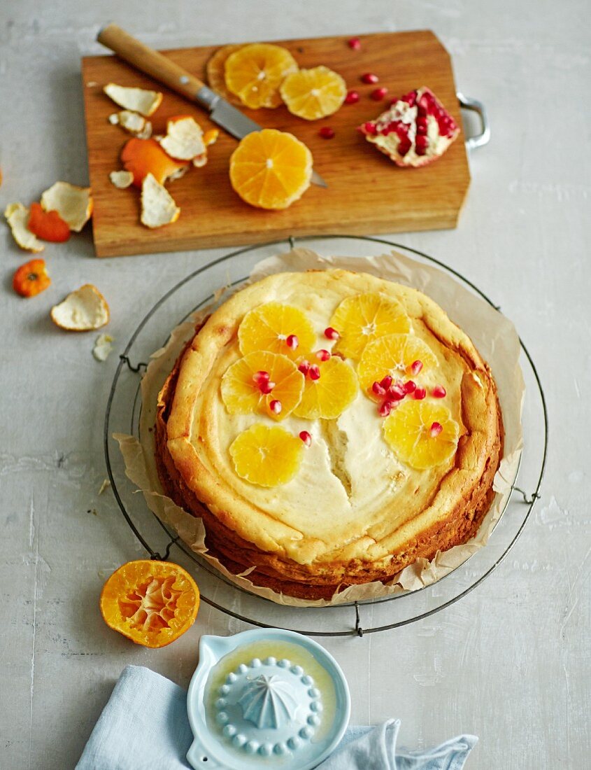 Low-fat orange cheesecake with a Melba toast and apricots base, low-fat quark, yoghurt cream cheese and pomegranate seeds