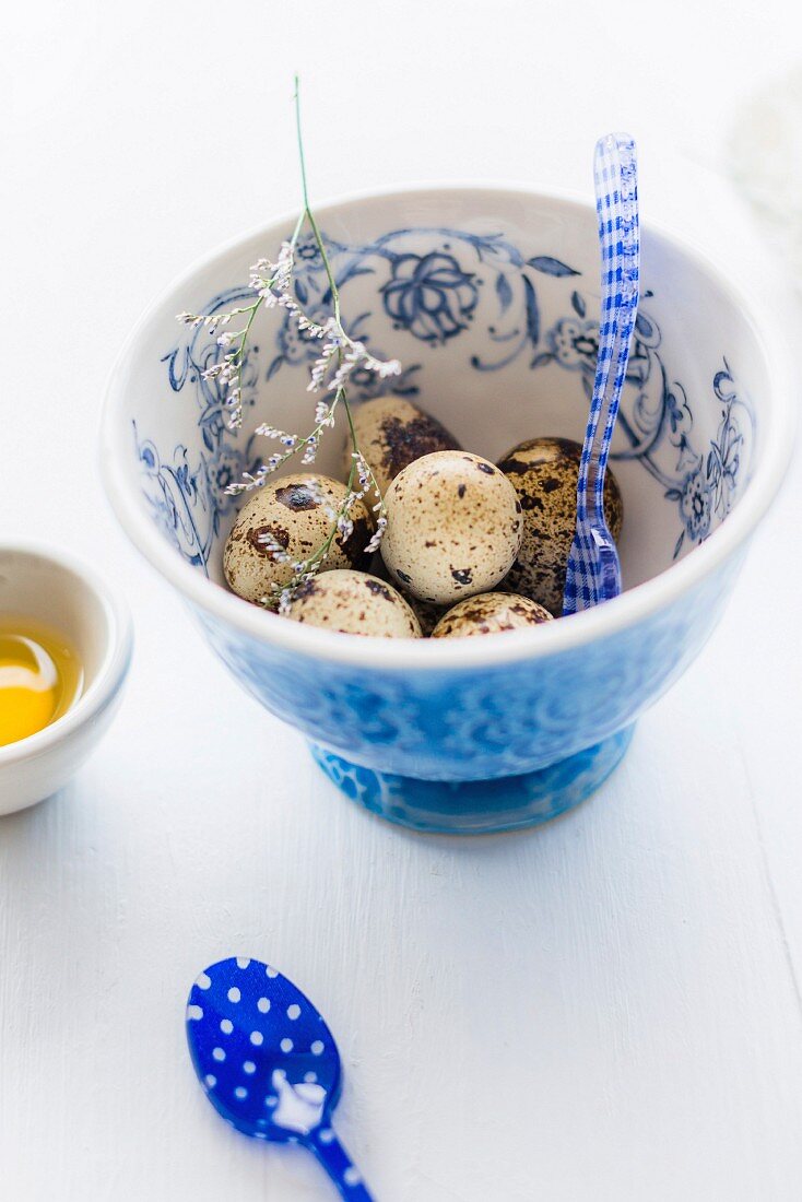 Quail eggs in a floral patterned bowl