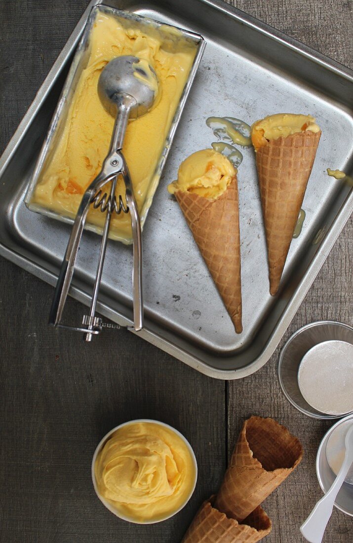 Ice cream cones with mango ice cream (seen from above)