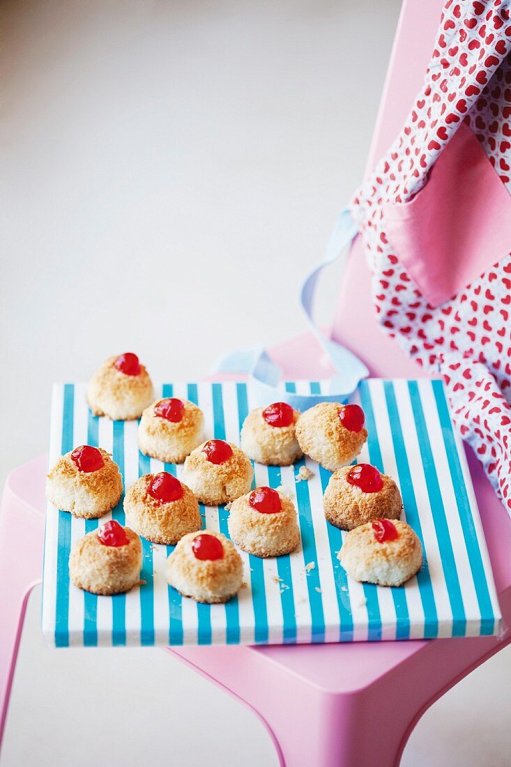 Coconut macaroons topped with glace cherries