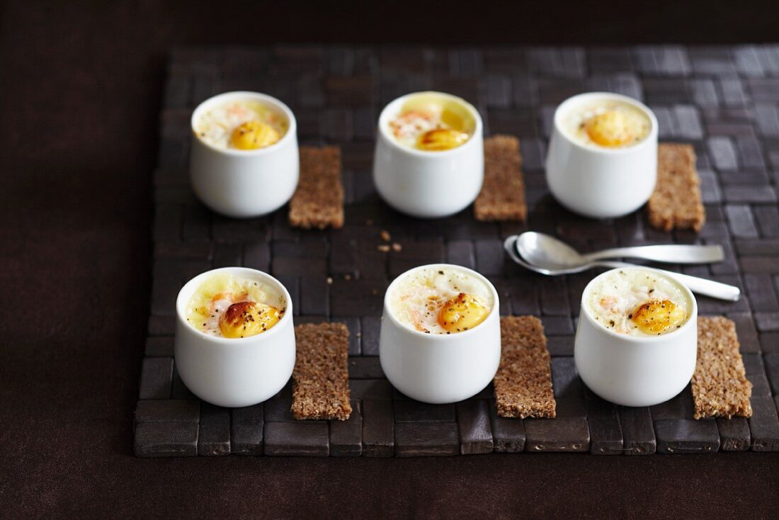 Eggs baked in ramekins with rye bread soldiers