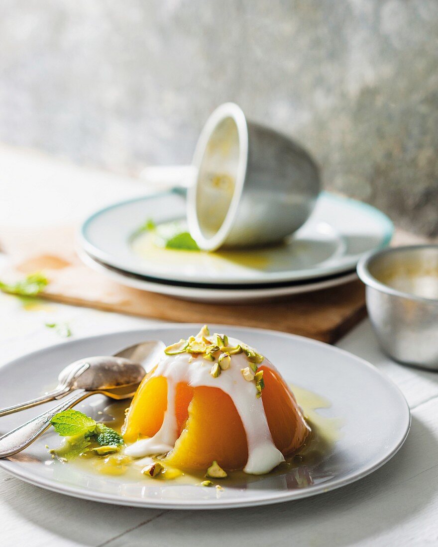 Citrus fruit jelly with yoghurt and pistachio nuts