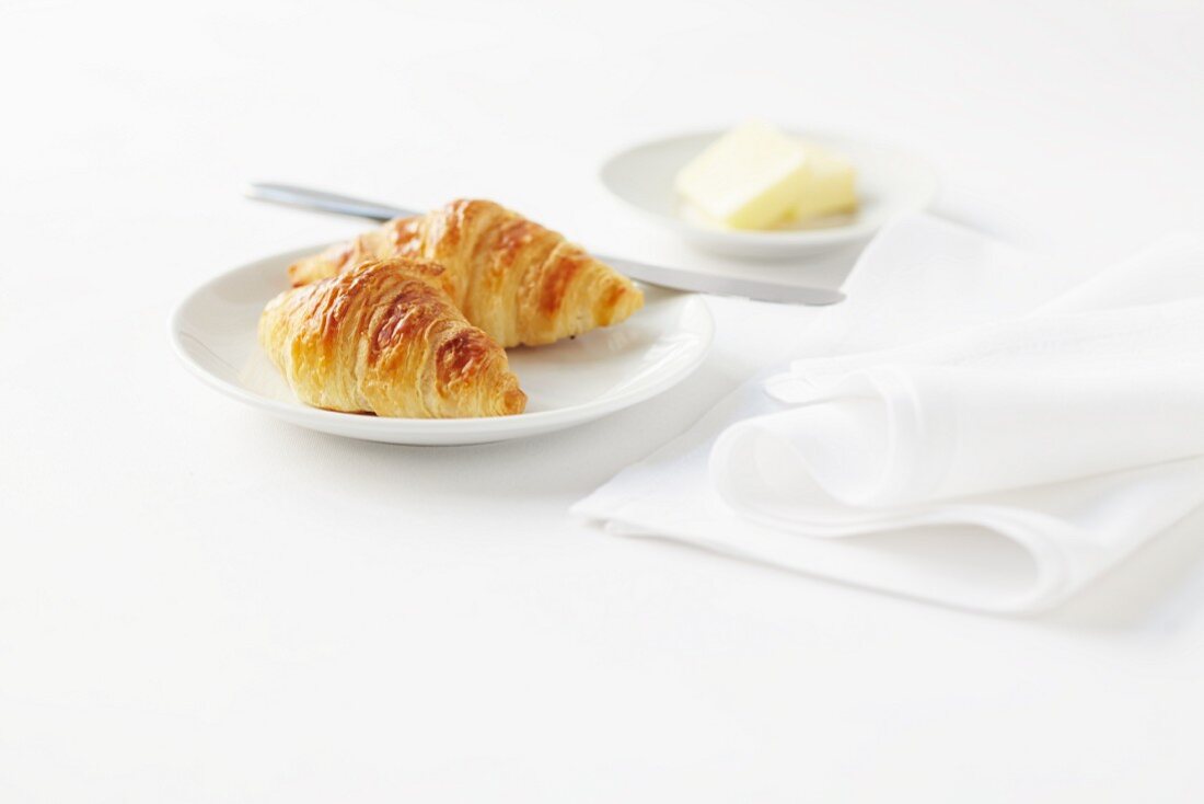 Two croissants and butter