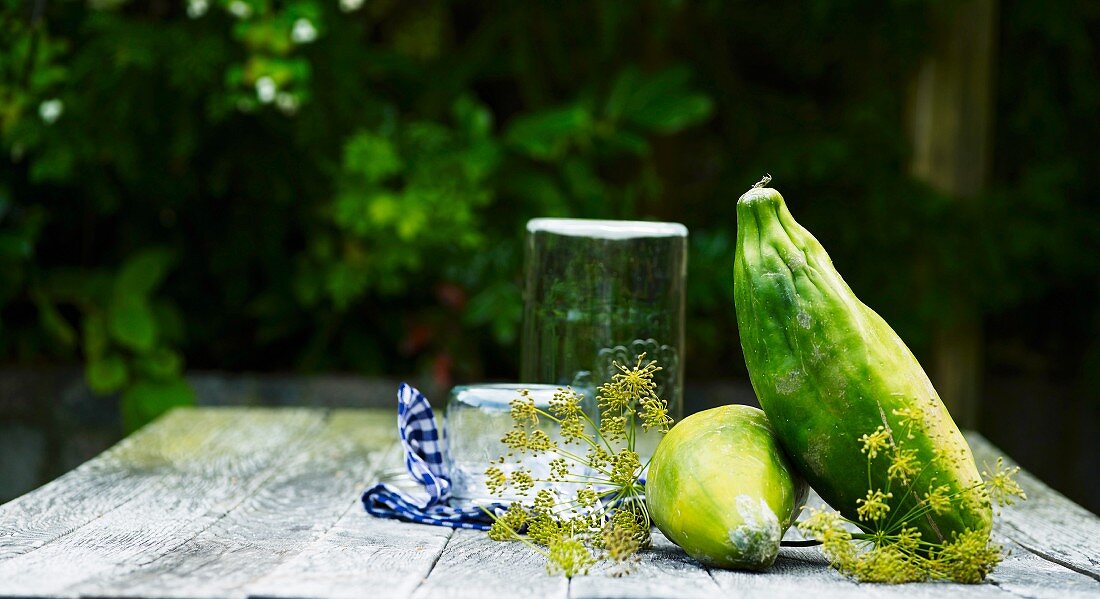 Exotic fruit on a wooden table with fennel flowers