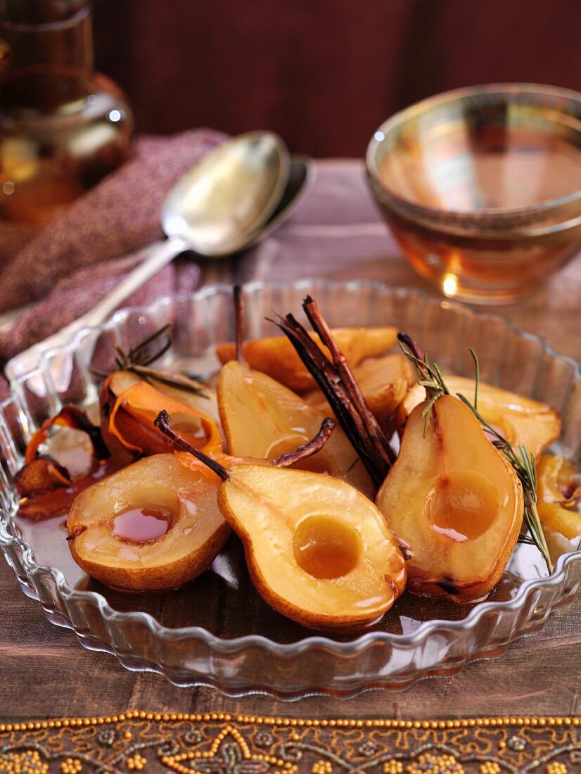 Caramelised roasted pears with cinnamon sticks