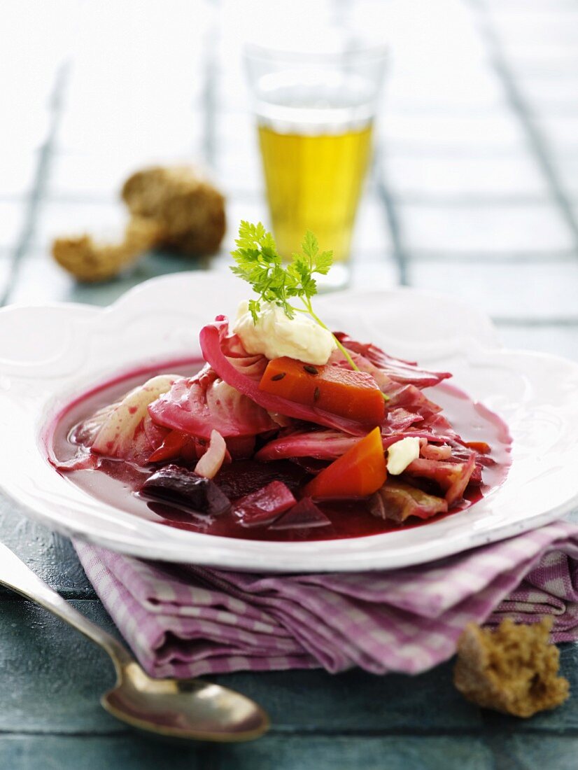 Beetroot soup with cabbage, carrots, onions, crème fraîche and chervil