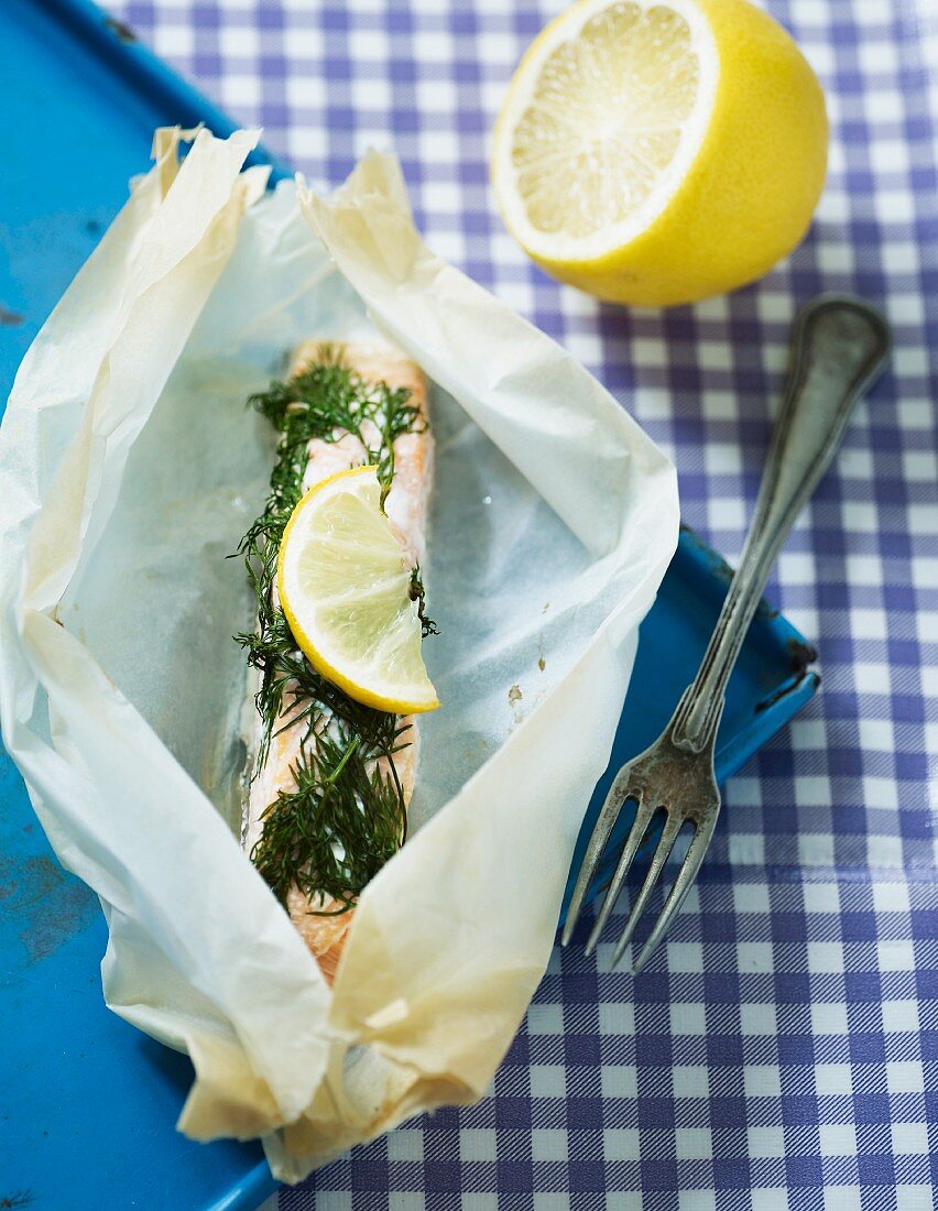 Salmon with dill and lemon in parchment paper