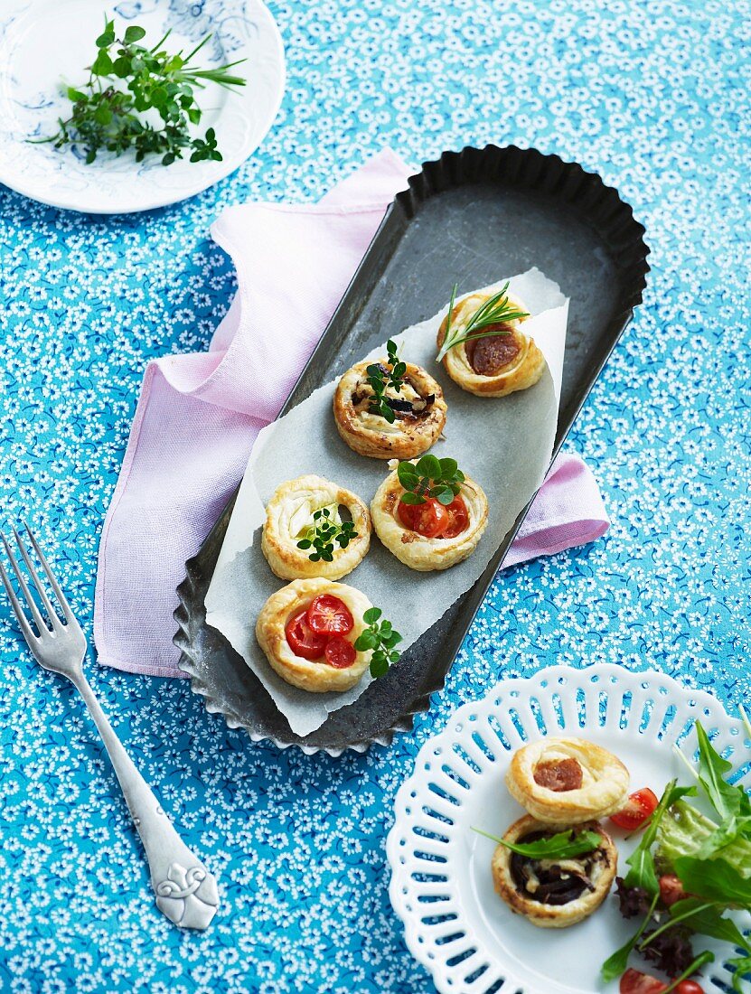 Various spicy puff pastry tartlets