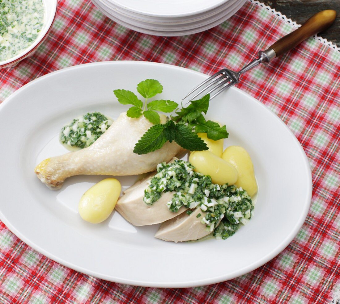 Poached chicken with a herb and egg sauce