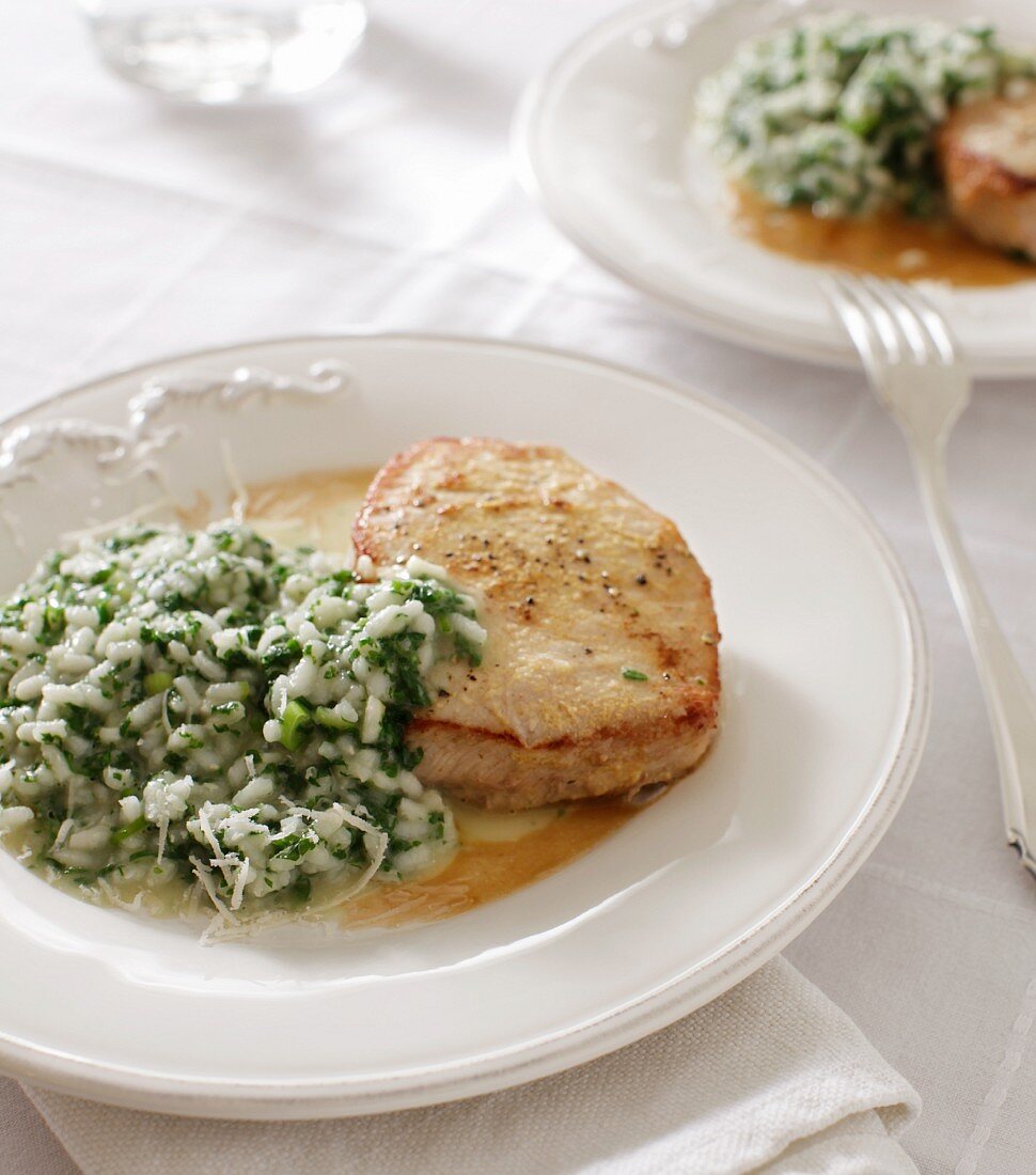 Fried pork medallions with stinging nettle risotto and Parmesan