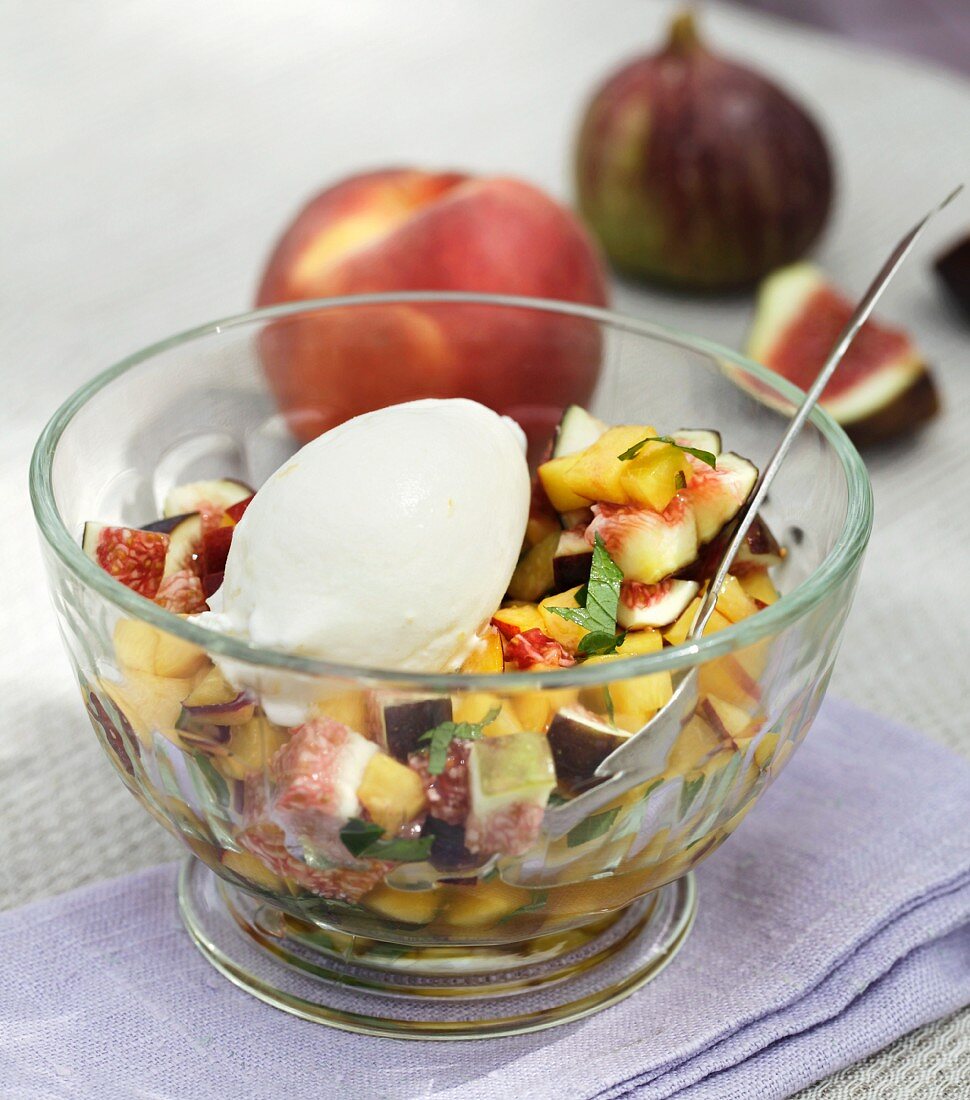 Fruit salad with homemade yoghurt ice cream