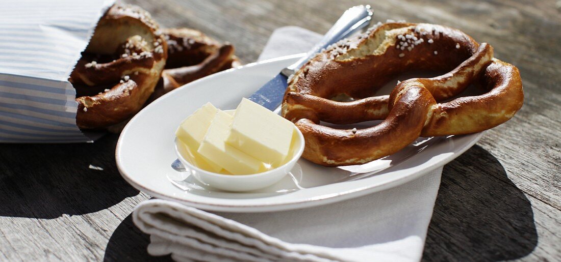 Homemade lye bread pretzels with fresh butter