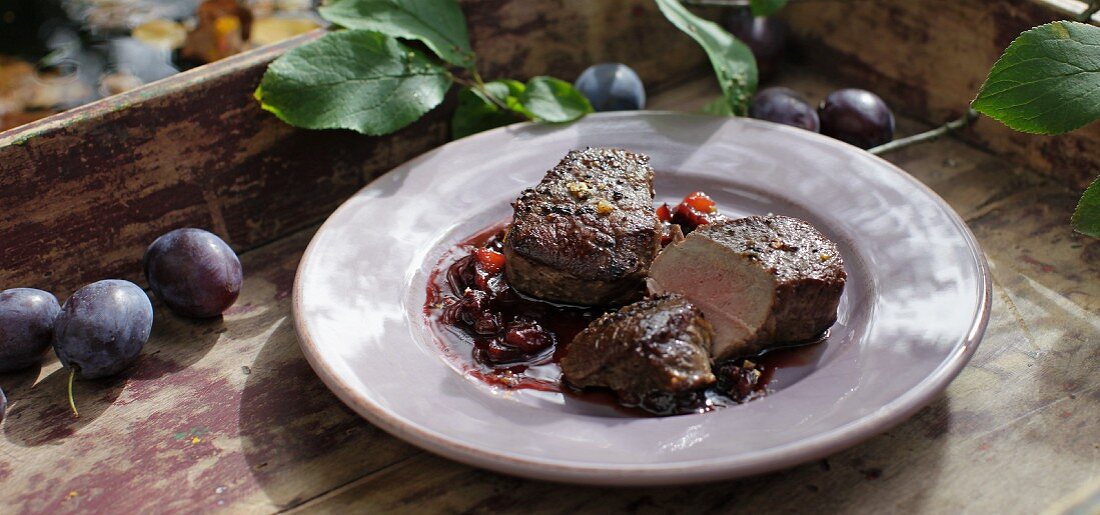Roasted venison medallions with damsons