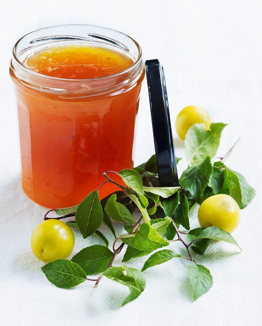 A jar of yellow plum jam