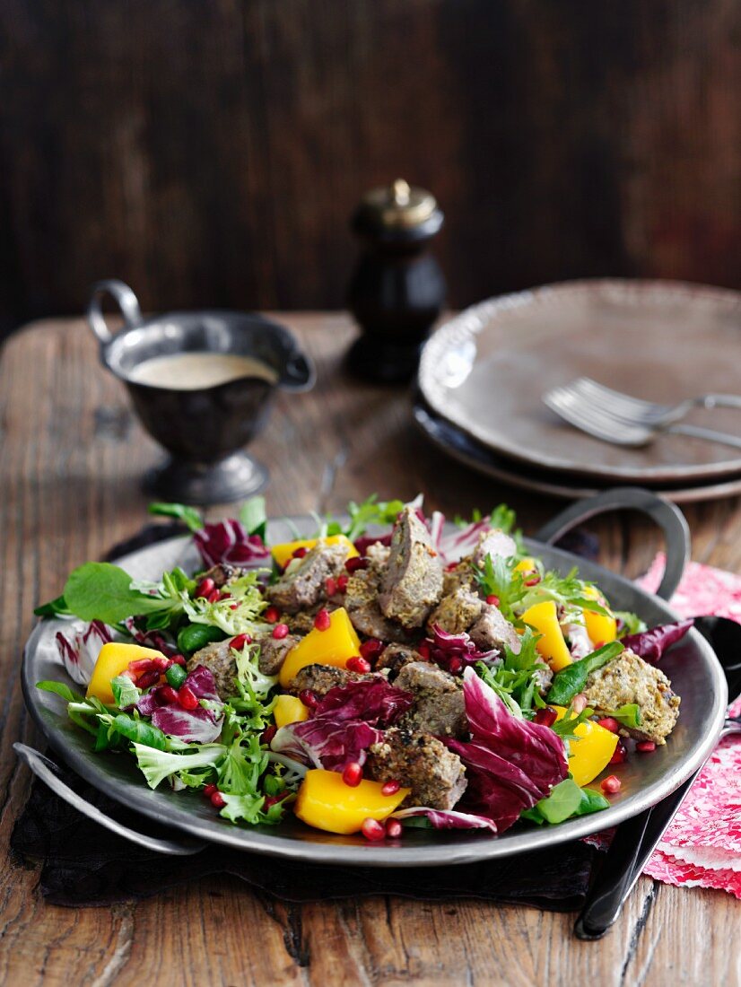 Lamb salad with yoghurt and pomegranate seeds