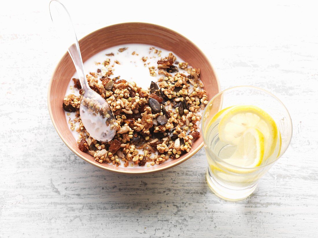 Granola made with buckwheat, flax seeds, sunflower seeds and raisins with almond milk