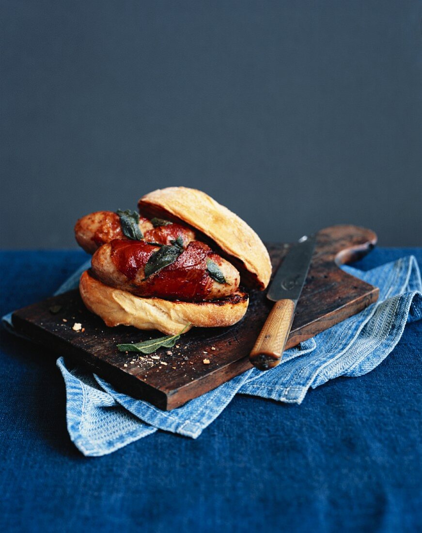 A ciabatta sandwich with sausage, sage and bacon