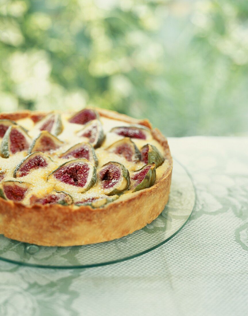 Fig and almond tart on a garden table