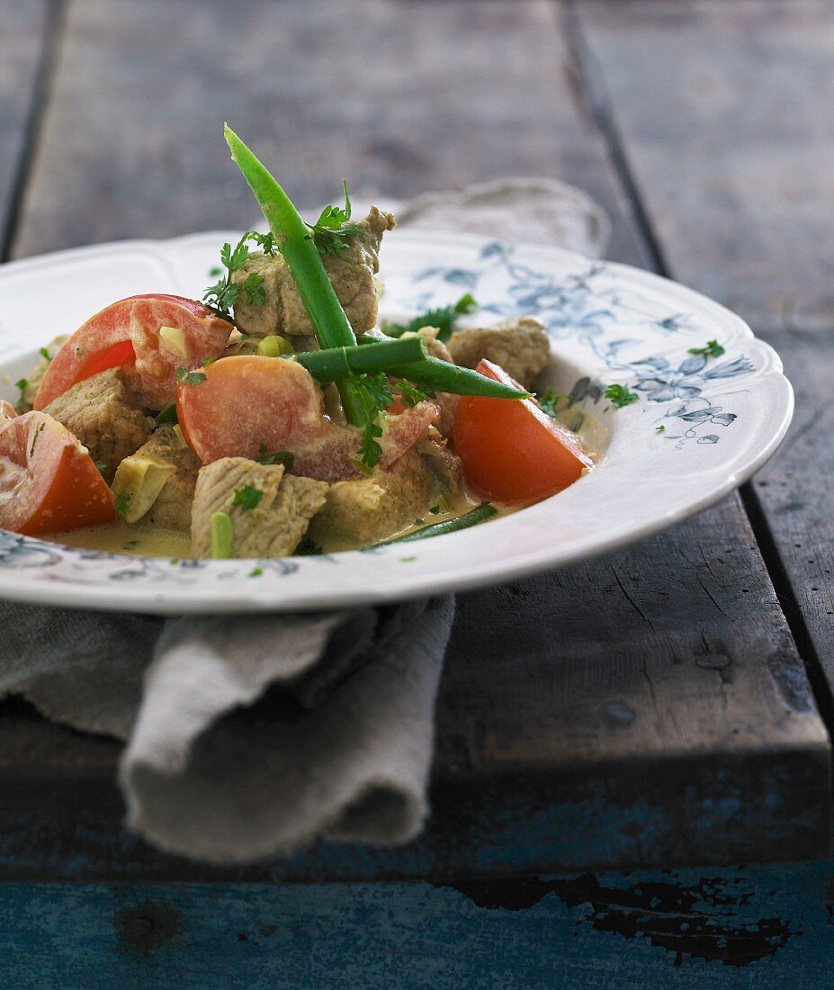 Veal ragout with lemon, tomatoes and green beans