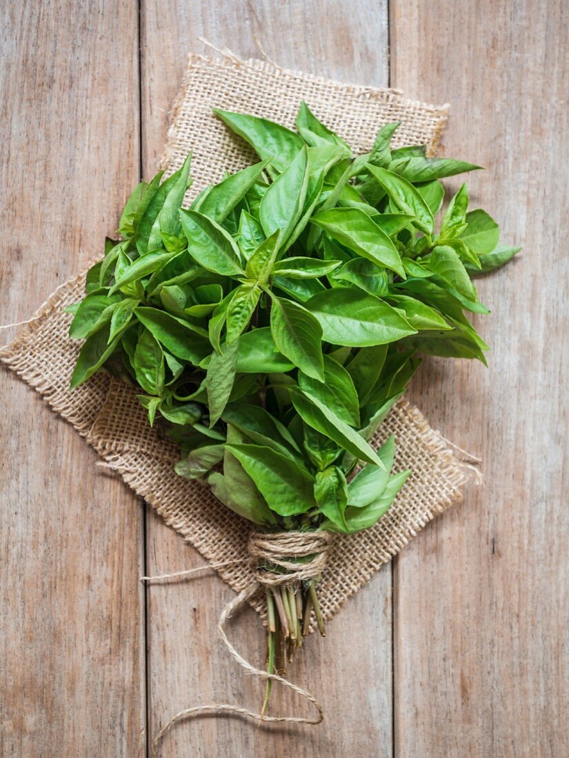 A bunch of basil on a piece of jute