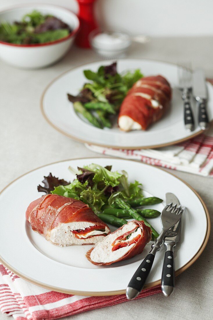 Chicken breast wrapped in Parma ham filled with cheese and roasted peppers