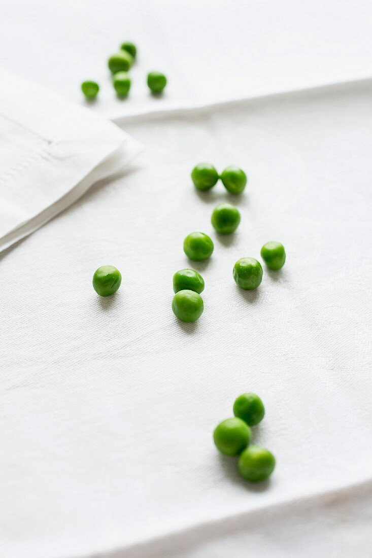 Peas on a white tablecloth