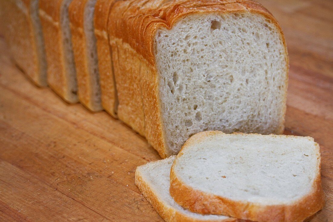 A sliced loaf of white bread